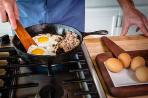 using Earlywood tera scraper to cook eggs in cast iron pan